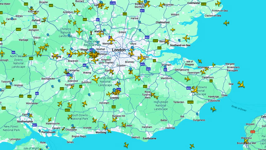 Air traffic map over London metropolitan area showing multiple aircraft positions, Real time aviation overview with commercial flights displayed on regional navigation interface