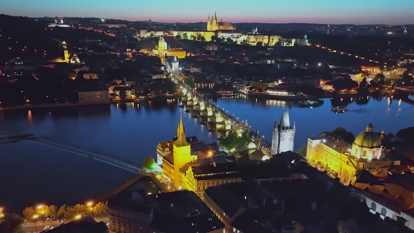 
Aerial view of Prague at night. The most beautiful view of the Charles Bridge at night and beautifully illuminated by lights. Czech Republic