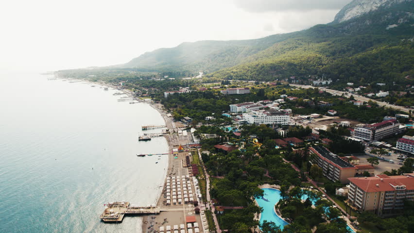 Aerial view of coastal town resort and mountains