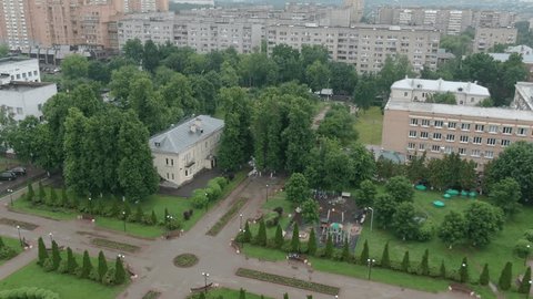 Drone Ascending Moving Backward above Park Area