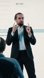 Vertical Video Inspirational business presentation at international summit with diverse mixed age audience, networking event in conference hall. Male CEO presenter speaks to listeners about - Powered by Shutterstock - Get 15% off with code: PIKWIZARD15