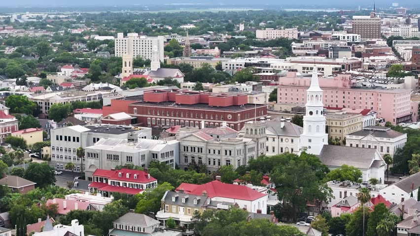 Aerial view of Charleston, South Carolina skyline landscapes with church steeples and downtown historic buildings on Atlantic coast port city - 4K Drone