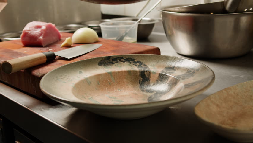 Asian Wok noodles cooking, Chef cooking handmade pasta wok frying pan close-up. Chinese traditional beef and chicken vegetables on fire pan, japanese korean pasta. Restaurant Food concept. Sea food.