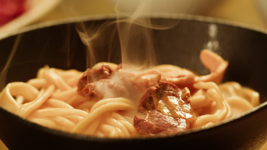 Japanese chinese hot pot noodles soup, Ramen with Beef or chicken, rice noodles with fried meat and mushrooms, Tom Yam kung Spicy Thai asian soup, chef cooking in traditional korean food. 