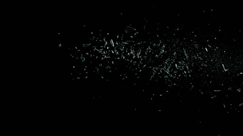 Super Slow Motion Shot of Real Side-Flying Glass Shards Isolated on Black at 1000 fps.