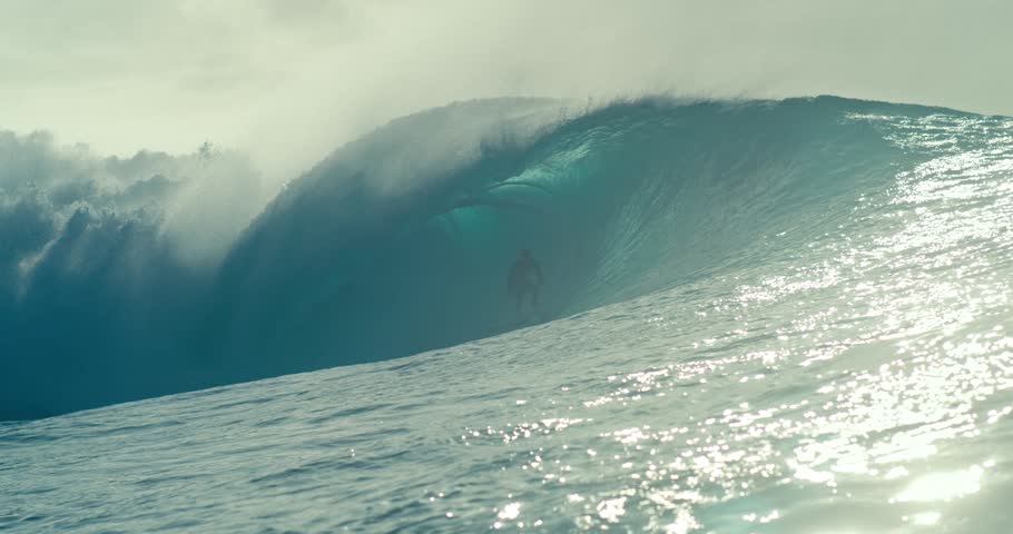 Man surfing waves in the ocean, extreme water sport, active lifestyle, adventure and athleticism, surfing motion, sunny day and ocean waves.