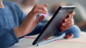 Close-up of a girl’s hand using a tablet in school, highlighting digital learning, education, technology, and interactive classroom activities in FHD. - Powered by Shutterstock - Get 15% off with code: PIKWIZARD15