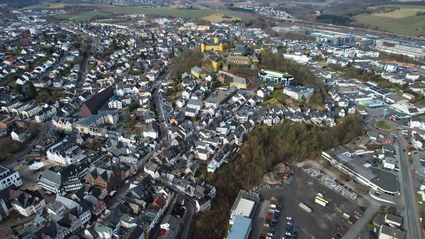 Aerial panoramic view around the old town of the city and castle Montabaur on a sunny autumn noon in Germany.