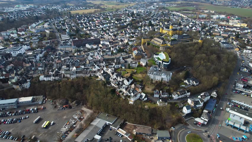 Aerial panoramic view around the old town of the city and castle Montabaur on a sunny autumn noon in Germany.