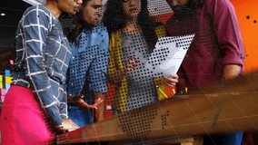 Animation of globe over diverse business people talking. Global business and digital interface concept digitally generated video. - Powered by Shutterstock - Get 15% off with code: PIKWIZARD15