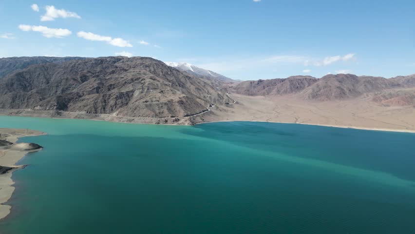 the sea at the foot of the mountains. a beautiful mountain lake. summer in the mountains
