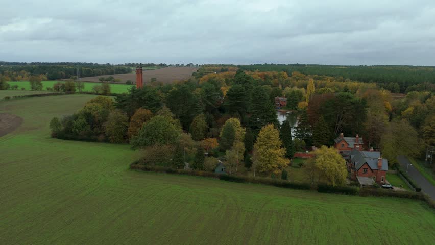 Aerial Drone View of Historic Pumping Station Surrounded by Autumn Forest and Fall Colours in Papplewick Near Nottingham United Kingdom