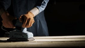 Professional carpenter sanding wooden plank using electric orbital sander machine in woodworking workshop - Powered by Shutterstock - Get 15% off with code: PIKWIZARD15
