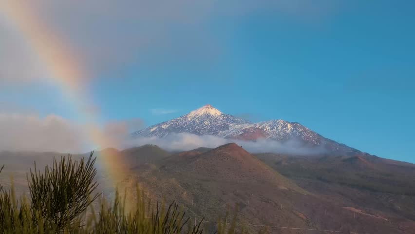 Beautiful view with rainbow of Mount Teide, Teide volcano in snow , Tenerife, Canary Islands, Spain,