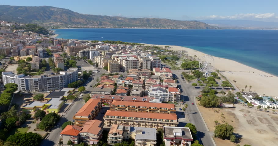 Aerial view of the town of Soverato, located on the Ionian coast of Calabria, in the province of Catanzaro, Italy. It is a popular summer tourist destination and has a large seafront promenade.
