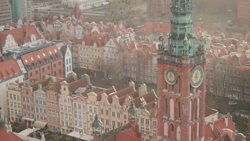 Cinematic video of Gdansk architecture filmed during cold winter sunset. The most colourful city in Poland. High resolution video. Small and beautiful city full of history, beautiful corners, markets and people. Cinematic movement. City where WW2 started. 