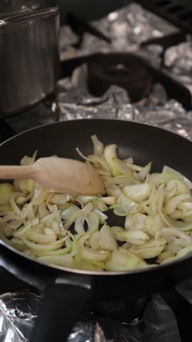 The cook in the kitchen prepares the filling for the dumplings.