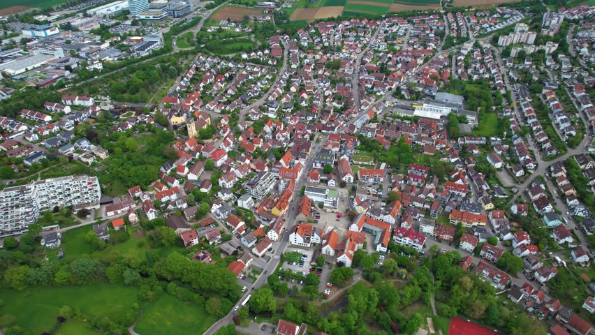 Aerial panoramic view around the old town of the city Schwieberdingen on a sunny spring noon in Germany.
