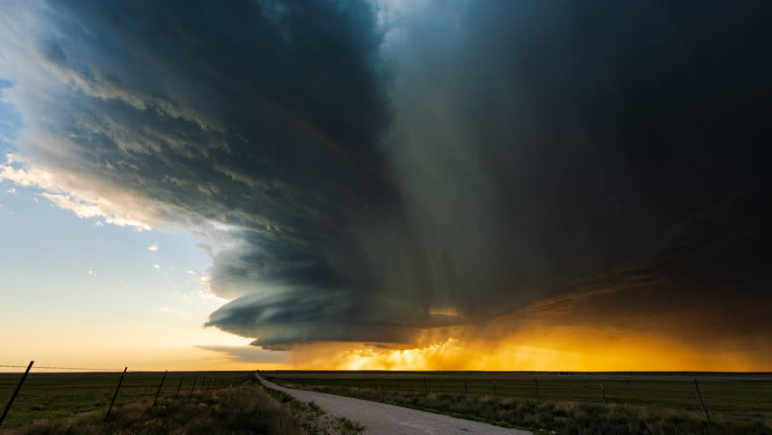 Epic storm clouds gather across a darkening sky, revealing intense weather change, layered cloud formations, and raw climate power as shifting light and motion signal an approaching severe atmospheric event