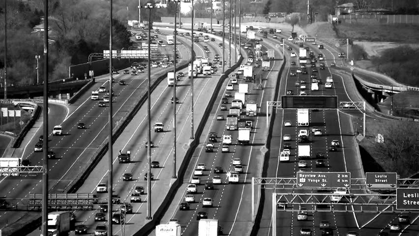 Traffic on highway 401. Longshot with heat shimmer. Toronto, Canada. 