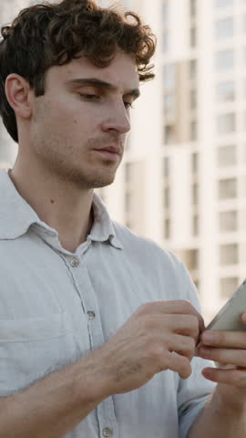 Worried pensive Caucasian business man using mobile phone GPS service lost in city looking around searching direction address businessman male guy agent holding smartphone search road way with app