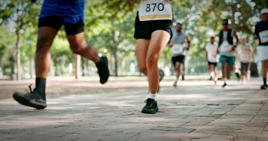 Legs, people and marathon competition at park for fitness challenge, sport event and running. Runners, shoes of group and race contest in nature for endurance test, jogging pace or cardio performance