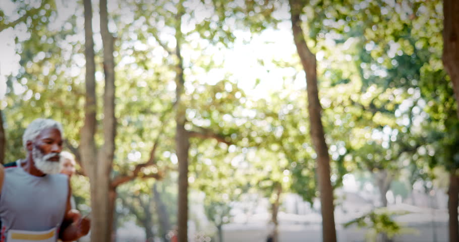 Marathon, people and running competition in forest for fitness challenge, sport event or wellness. Runners, group and race contest in nature for endurance trail, jogging stamina or cardio performance