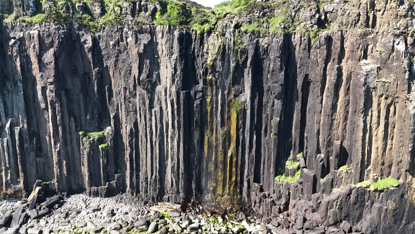 Aerial footage of Kilt Rock cliffs and Mealt Falls, Scotland, United Kingdom