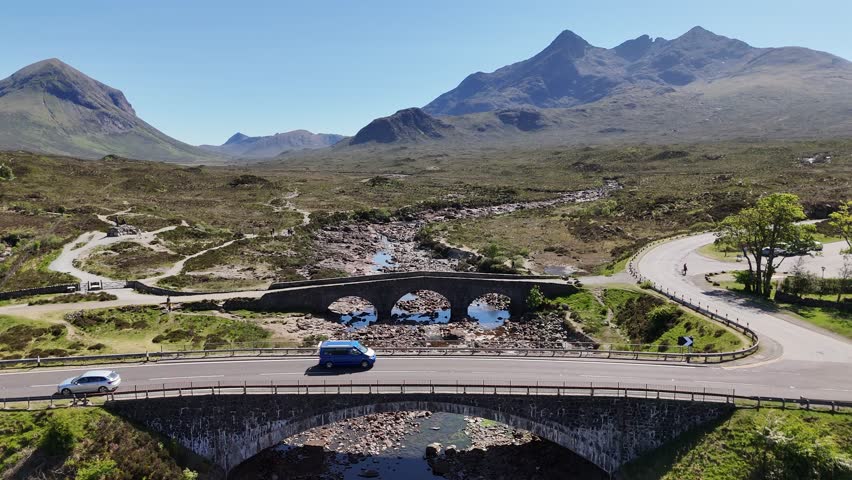 Aerial footage of Sligachan Old Bridge and Cuillin Mountains, Scotland, UK