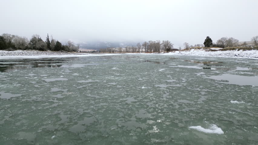 Ascending over river of ice in Montana
