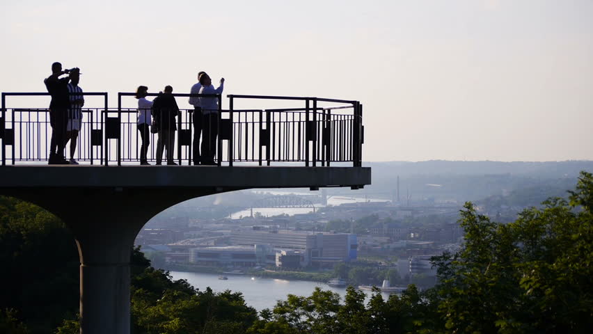 PITTSBURGH, PA - Circa May, 2013 - Silhouetted tourists gather on an overlook on