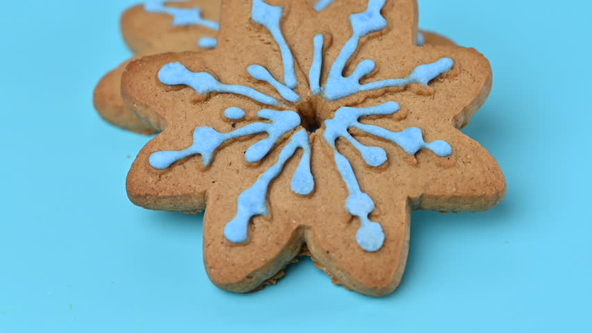 A close-up video of a snowflake gingerbread cookie