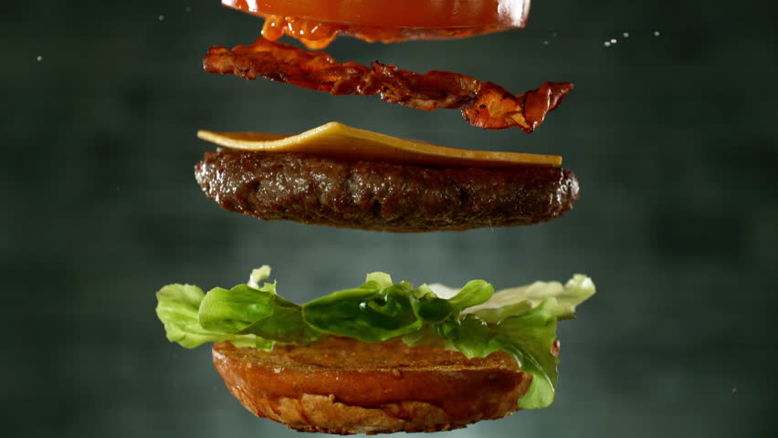 Beef Burger Ingredients Falling and Landing in the Bun. Super Slow Motion at 1000 fps