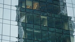 Reflective glass skyscraper facade with gridded windows capturing distorted reflections of surrounding modern towers, patterns, and interior office lights in an urban setting - Powered by Shutterstock - Get 15% off with code: PIKWIZARD15