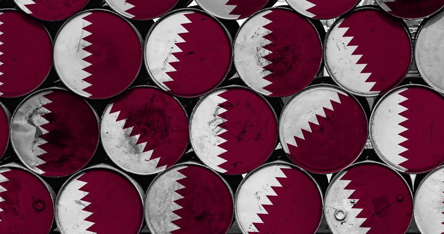 a panning of a lot of oil rusty barrels with the qatar flag