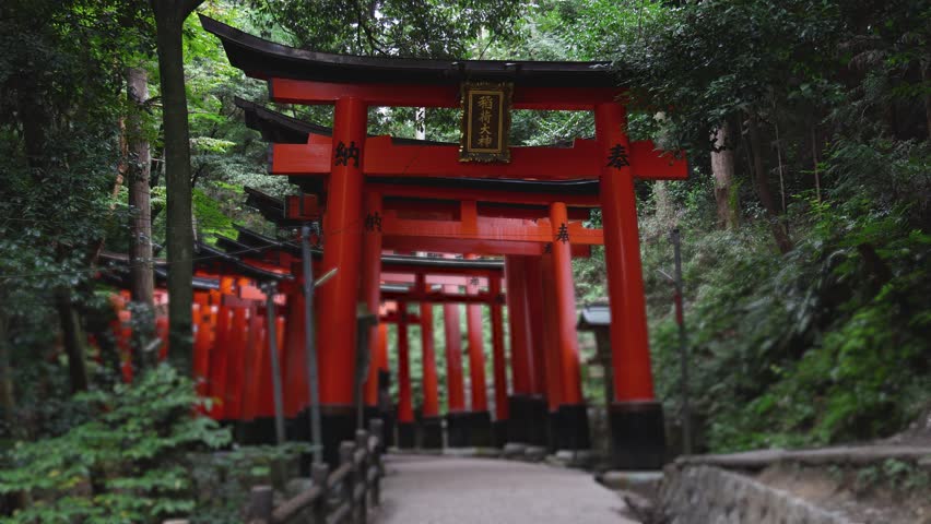 Fushimi Inari Taisha Shrine, Fushimi-ku, Kyoto Prefecture, Kansai region, Kyoto, Japan, Shinto shrine, mountain way with red torii gates tunnel, wooden torii path, fox sculptures, travel to Japan