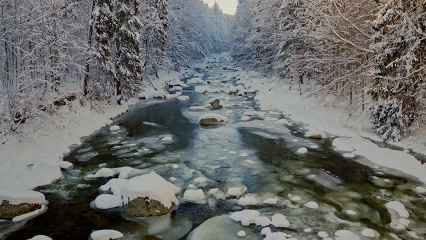Beautiful Winter Mountain River Covered with Ice and Snow