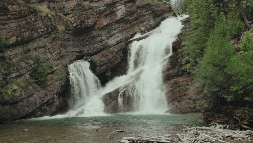 Water flows over rocks at Cameron Falls in Waterton Lakes National Park