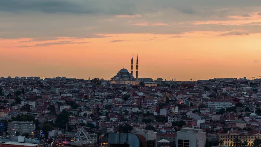 Epic sunset time-lapse with a mosque silhouette against a colorful sky. A breathtaking time lapse capturing the sun setting behind a mosque.