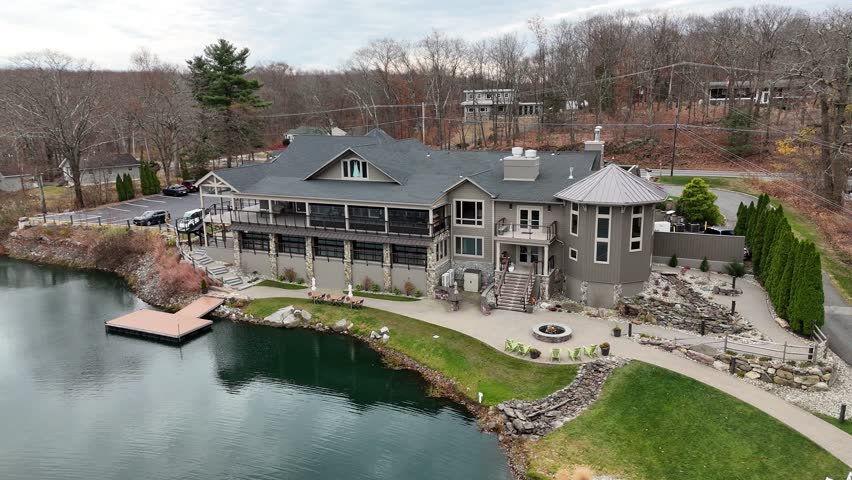 Aerial View of Rock Island Lake Club with Waterfall in the Middle of the Lake
