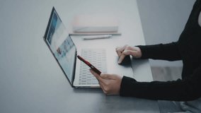 Digital technology concept with woman using smartphone and laptop - Powered by Shutterstock - Get 15% off with code: PIKWIZARD15