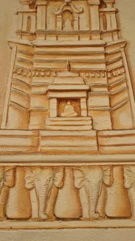 Stunning stupa sculpture, possibly carved from sandstone, at Paravi Duwa Raja Maha Viharaya, a Buddhist temple on a small island off the coast of Matara in southern Sri Lanka