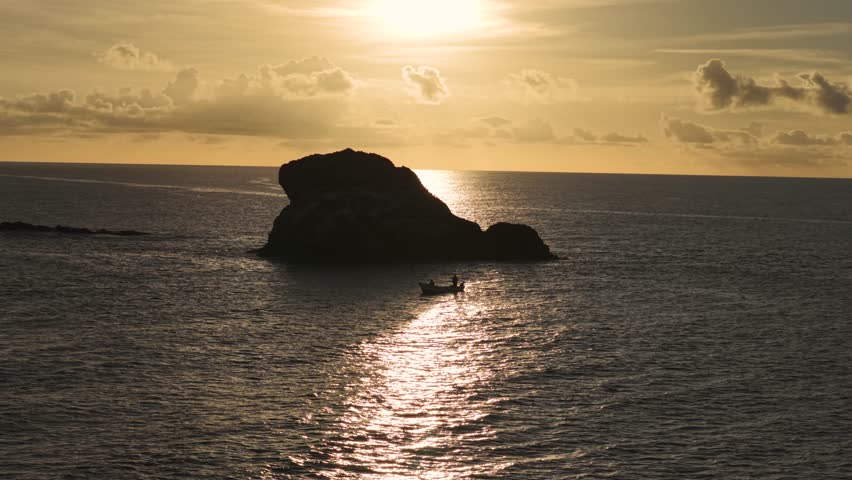 Sunset drone clip of rock Island.