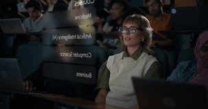 Female University Student Wearing VR Glasses Uses AR Gestures in a Lecture Hall, Selecting AI Course Modules. Holograms of Digital Brain and Neural Network. Immersive Learning, Data Visualization - Powered by Shutterstock - Get 15% off with code: PIKWIZARD15