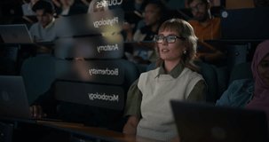 Female College Student With Glasses in Lecture Hall to Browse an AR Data Information, Activating Holographic Human Anatomy Model, Immersive Medical education, VR Interface, Smart Campus Learning - Powered by Shutterstock - Get 15% off with code: PIKWIZARD15