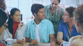 Animation of fake news text, globe and programming language over diverse coworkers sharing ideas. Digital composite, multiple exposure, globalization, office, coding, fraud, teamwork, technology. - Powered by Shutterstock - Get 15% off with code: PIKWIZARD15