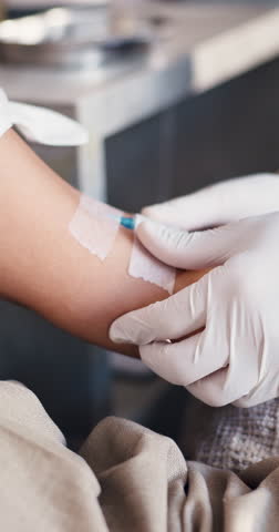 Wellness, preparation or hands in center for iv therapy, fluid tube or vein care in supplement treatment. Procedure, people or practitioner with arm check, pulse or injection safety in detox lounge.