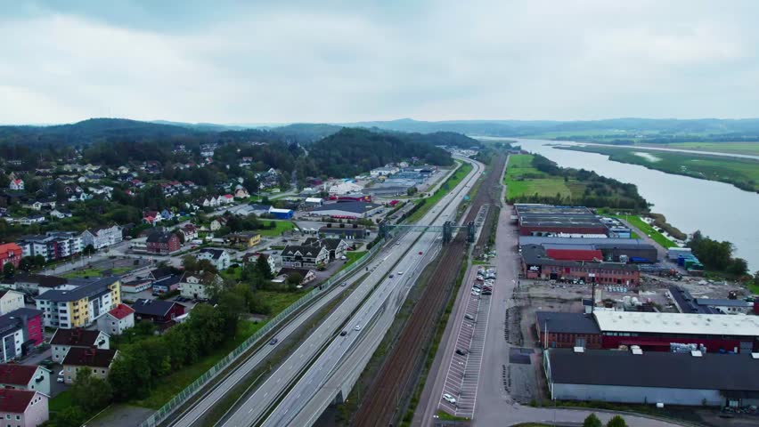 Aerial view of E45 in Älvängen, near Gothenburg, beside serene river scenery