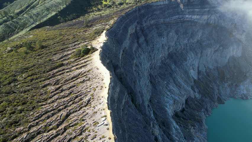 Kawah Ijen Crater Rim Java Indonesia Drone Tracks Left Across Rocky Edge 4K 30FPS