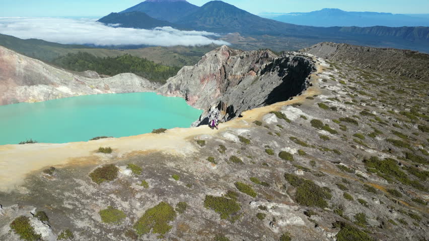 Hiking Trail Around Kawah Ijen Volcano Crater Rim With Tourists Drone Pull Back Long 4K 30FPS